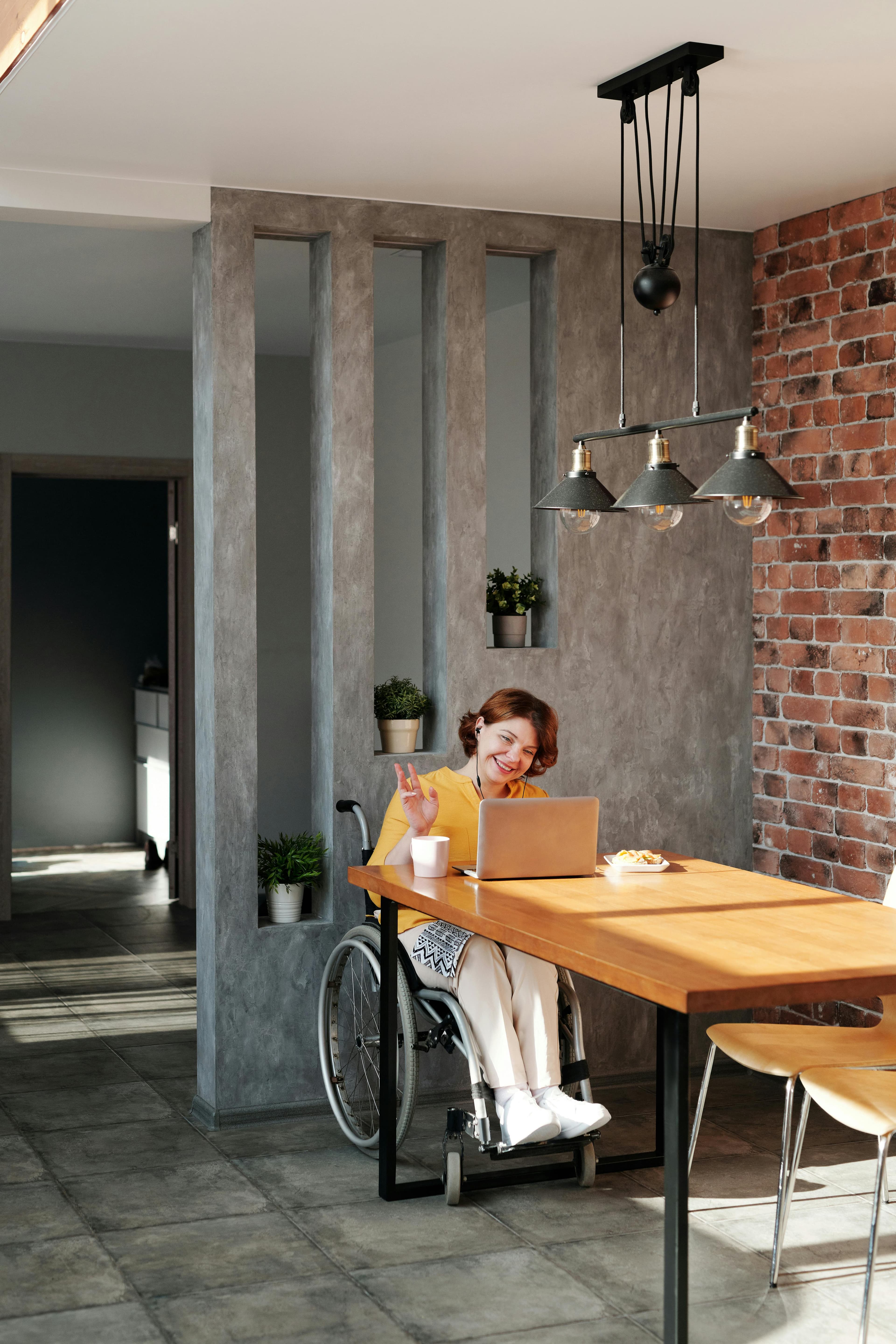 Person in wheelchair working at desk